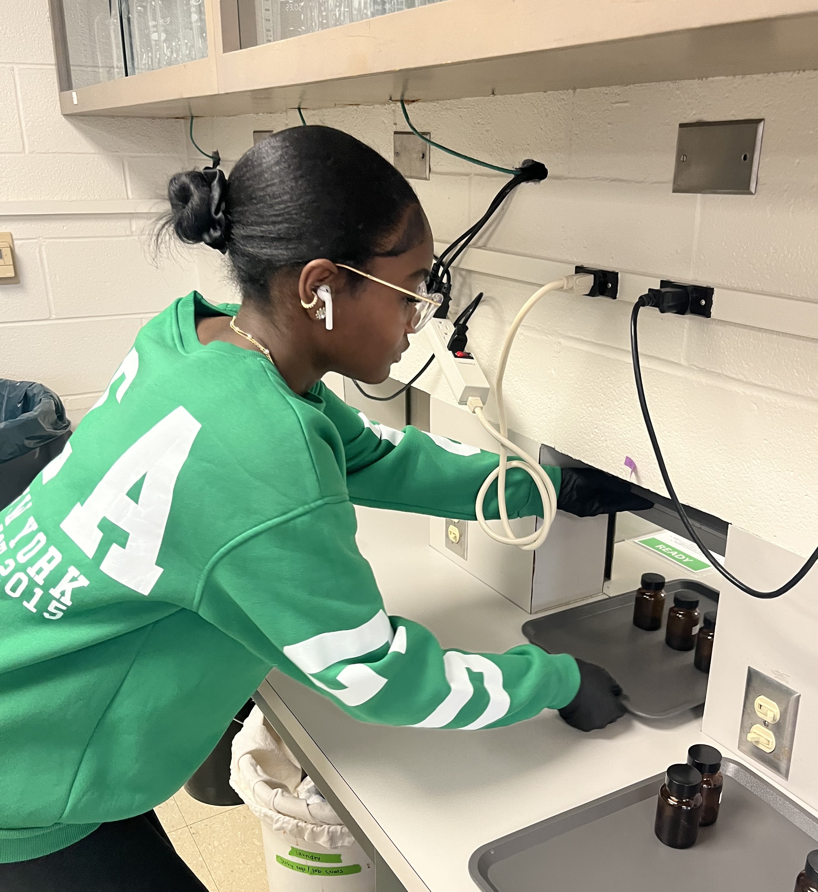 A photo of Alyssa Hawkins performing tasks in a laboratory setting